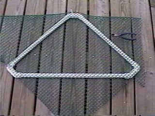 Cut a piece of plastic mesh to fit the frame.